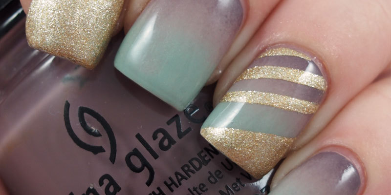 Stormy gradient mani with gold striped accent